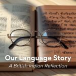 Two open books with reading glasses, representing the exploration of language and heritage by British Indians.